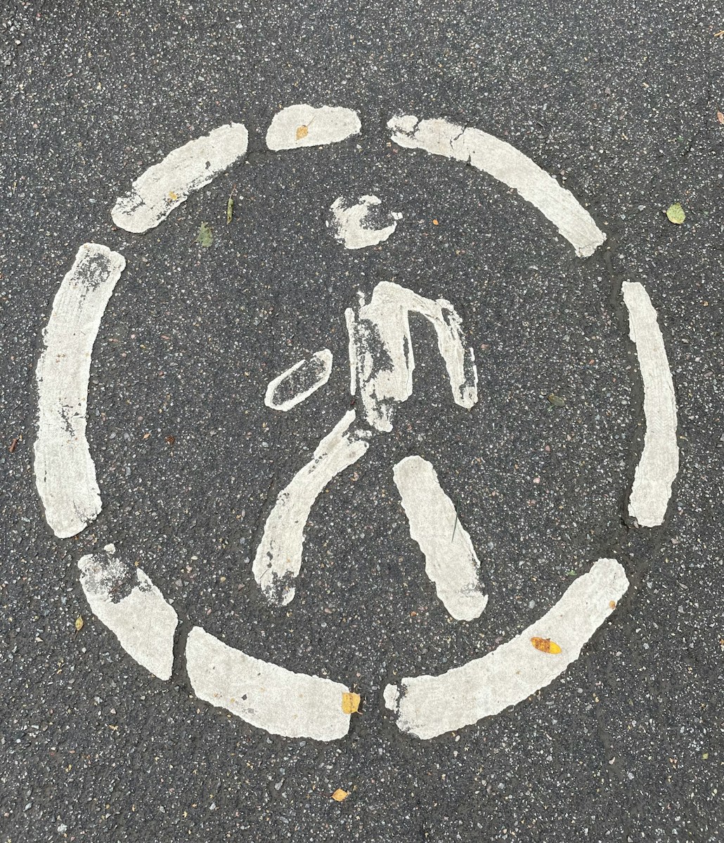 a picture of a peace sign painted on the pavement